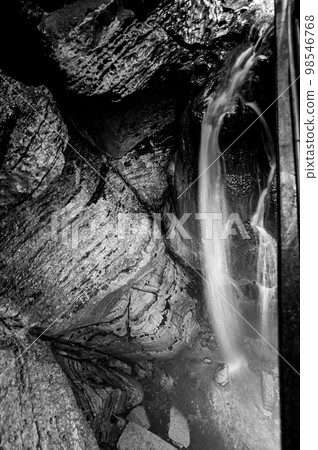 Flowing waterfall underground in Niagara Cave, MN 98546768