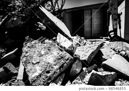 Sidewalk being replaced and old slabs broken and pilled at construction site. Sidewalk being replaced and old slabs broken and pilled at construction site. 98546855