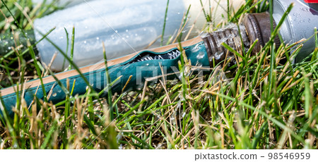 Frayed garden hose with burst section spraying water from the point of connection Frayed garden hose with burst section spraying water from the point of connection 98546959