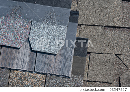 Assorted selection of premium synthetic roof shingles to pick a new style. 98547237