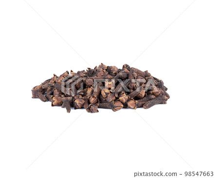 A bunch of dried unopened cloves on a white background. 98547663