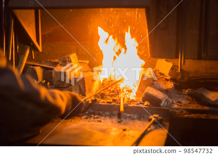 Burning fire in furnace Burning fire in furnace 98547732