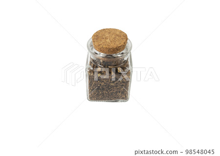 Valerian herb root in a glass jar isolated on white background. Valeriana officinalis. used in herbal medicine as a tranquillizer and to treat insomnia, anxiety, hypertension, pain relief. 98548045