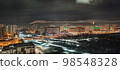 colored apartment buildings in the fog in night 98548328