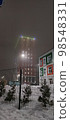 colored apartment buildings in the fog in night 98548331