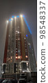 colored apartment buildings in the fog in night 98548337