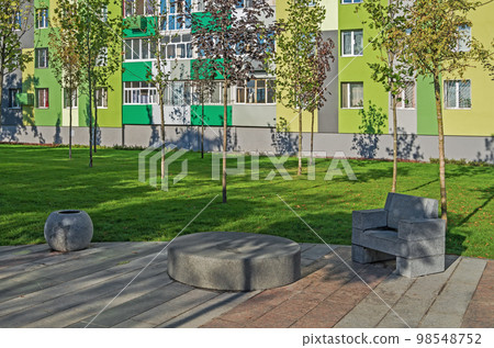 Recreational area in the courtyard of multistorey building 98548752