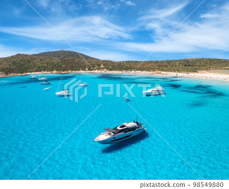 Aerial view of luxury yachts on blue sea at sunny day Aerial view of luxury yachts on blue sea at sunny day 98549880