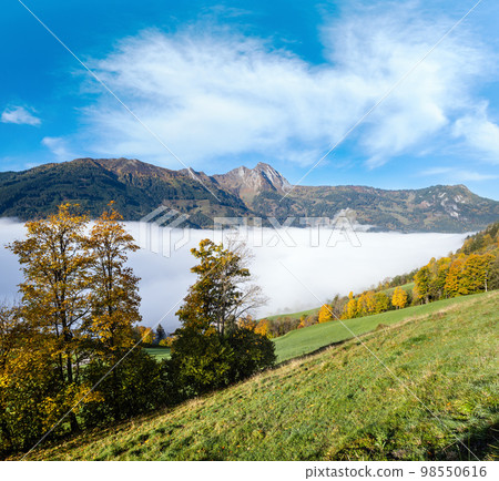 Peaceful misty autumn morning mountain view from hiking path from Dorfgastein to Paarseen lakes, Land Salzburg, Austria. Peaceful misty autumn morning mountain view from hiking path from Dorfgastein to Paarseen lakes, Land Salzburg, Austria. 98550616