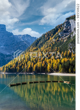 Autumn peaceful alpine lake Braies or Pragser Wildsee. Fanes-Sennes-Prags national park, South Tyrol, Dolomites Alps, Italy, Europe. Picturesque traveling, seasonal and nature beauty concept scene. Autumn peaceful alpine lake Braies or Pragser Wildsee. Fanes-Sennes-Prags national park, South Tyrol, Dolomites Alps, Italy, Europe. Picturesque traveling, seasonal and nature beauty concept scene. 98550622