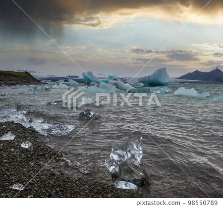Jokulsarlon glacial lake, lagoon with ice blocks, Iceland. Situated near the edge of the Atlantic Ocean at the head of the Breidamerkurjokull glacier, Vatnajokull icecap or Vatna Glacier. Jokulsarlon glacial lake, lagoon with ice blocks, Iceland. Situated near the edge of the Atlantic Ocean at the head of the Breidamerkurjokull glacier, Vatnajokull icecap or Vatna Glacier. 98550789