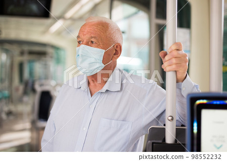 Old man in streetcar 98552232