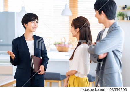 Husband and wife couple family real estate living room business sales 98554503