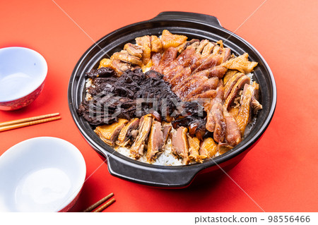 Lap mei fan or waxed meat rice is Chinese traditional dish that is served during Chinese New Year festive. With two bowls ready to be served Lap mei fan or waxed meat rice is Chinese traditional dish that is served during Chinese New Year festive. With two bowls ready to be served 98556466
