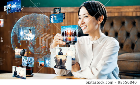 Woman watching a picture Woman watching a picture 98556840