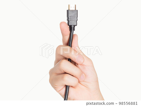closeup hand holding computer HDMI cable plug 98556881