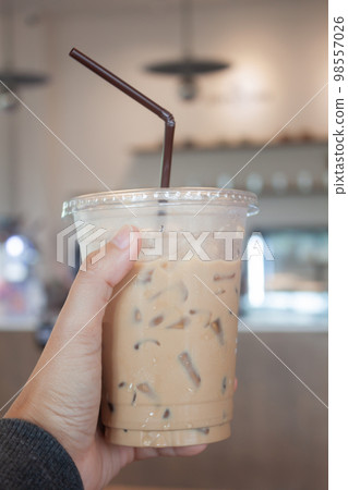 Black coffee with orange juice and iced mocha on wooden table Black coffee with orange juice and iced mocha on wooden table 98557026