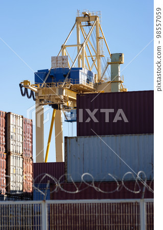 Viewpoint above the cargo seaport with lots of containers 98557059