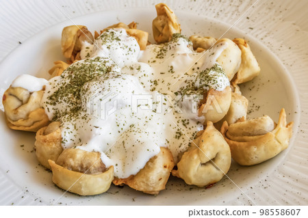 Manti is one favorite Turkish traditional dishes. Manti is very popular and common with or without yogurt in Turkey. Manti is one favorite Turkish traditional dishes. Manti is very popular and common with or without yogurt in Turkey. 98558607