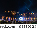 Crowd watching fireworks and celebrating new year eve 98559323