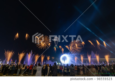 Crowd watching fireworks and celebrating new year eve Crowd watching fireworks and celebrating new year eve 98559323