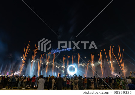 Crowd watching fireworks and celebrating new year eve 98559325