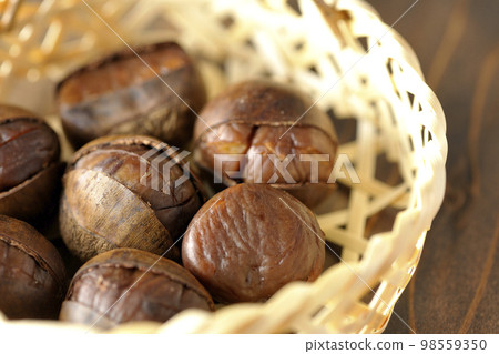 sweet chestnuts in a bamboo basket 98559350