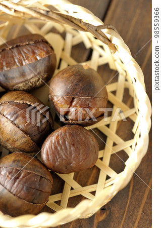 sweet chestnuts in a bamboo basket 98559366