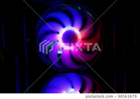 Colorful bright rainbow led rgb pc fan air case cooler. Computer chassis. Gaming modding, technology concept and IT background. Colorful bright rainbow led rgb pc fan air case cooler. Computer chassis. Gaming modding, technology concept and IT background. 98561679