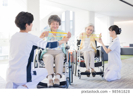 Nursing care image Senior woman doing gymnastics and a physiotherapist Photography cooperation "LINK FOREST" 98561828