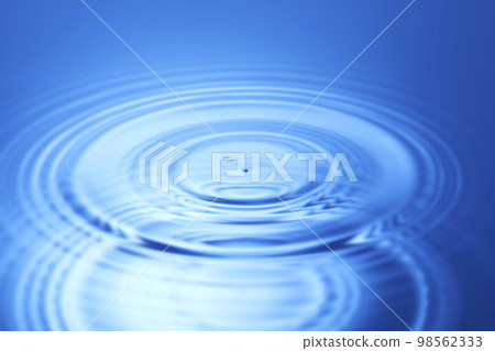 water drops falling into deep blue water 98562333