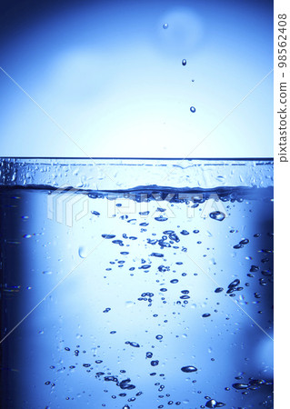 water drops falling into deep blue water water drops falling into deep blue water 98562408
