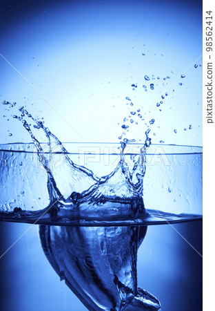 water drops falling into deep blue water water drops falling into deep blue water 98562414