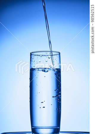 water drops falling into deep blue water water drops falling into deep blue water 98562515