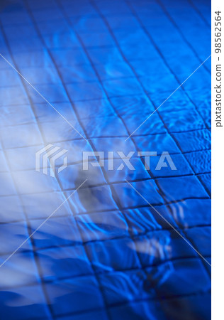 water drops falling into deep blue water water drops falling into deep blue water 98562564