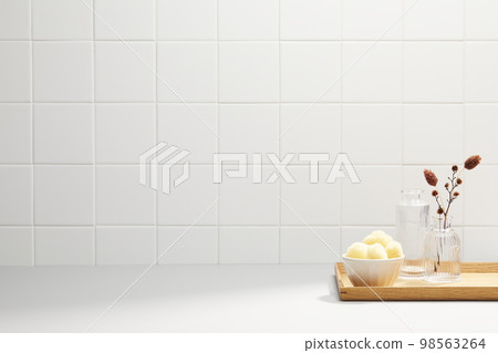 Various bathroom accessories on a tiled background Various bathroom accessories on a tiled background 98563264