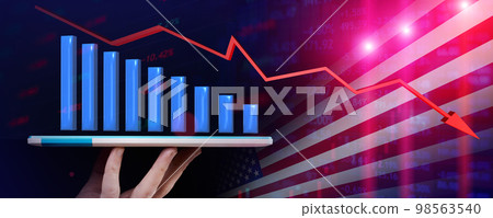 Falling stock chart emerges from a tablet that a man holds with falling arrow against the backdrop of the US flag 98563540