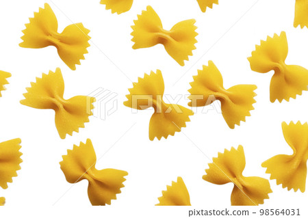 Dry raw uncooked farfalle pasta background. Flat lay 98564031
