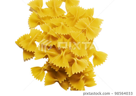 Dry raw uncooked farfalle pasta background. Flat lay 98564033