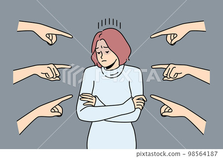 Unhappy woman surrounded with numerous hands pointing  98564187