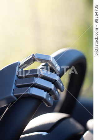 Robot arm on a steering wheel Robot arm on a steering wheel 98564738