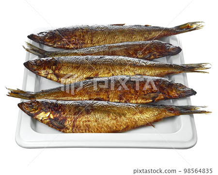 Five delicious smoked herring, lying on a rectangular plate, isolated on a white background. Delicious, natural and healthy food.. 98564835
