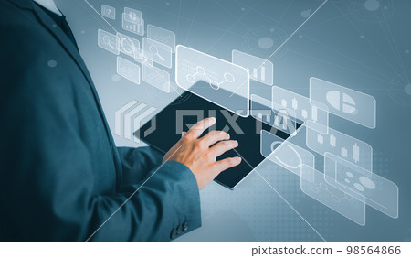 Businessman using tablet in data management. Business, technology, internet and networking concept.. Businessman using tablet in data management. Business, technology, internet and networking concept.. 98564866