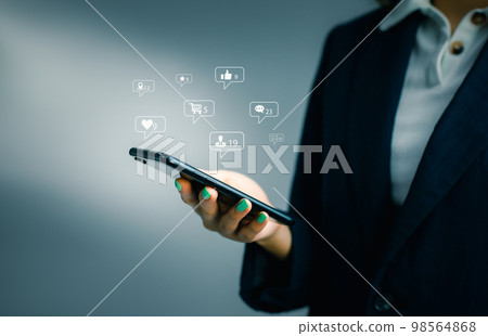Businesswoman using smartphone in hand with Social media concept.. Businesswoman using smartphone in hand with Social media concept.. 98564868