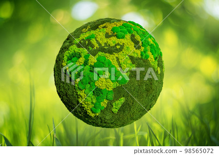 Green planet Earth from natural moss on a blured nature background. 98565072