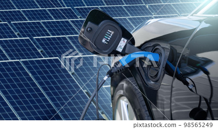 Close up of electric car with a connected charging cable Close up of electric car with a connected charging cable 98565249