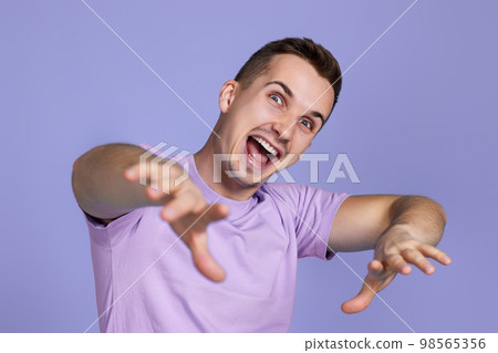 optimistic caucasian man pointing finger at you optimistic caucasian man pointing finger at you 98565356