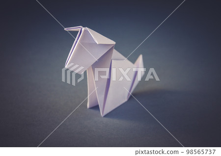 White paper dog origami isolated on a grey background 98565737