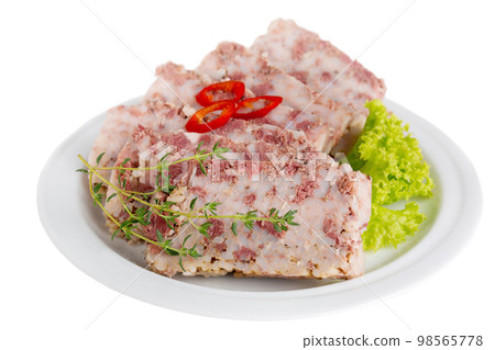 Canned rice porridge with meat, chili pepper and thyme served on a plate 98565778