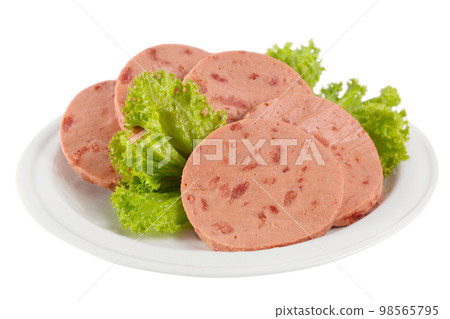 Canned beef sausage on a plate with lettuce 98565795